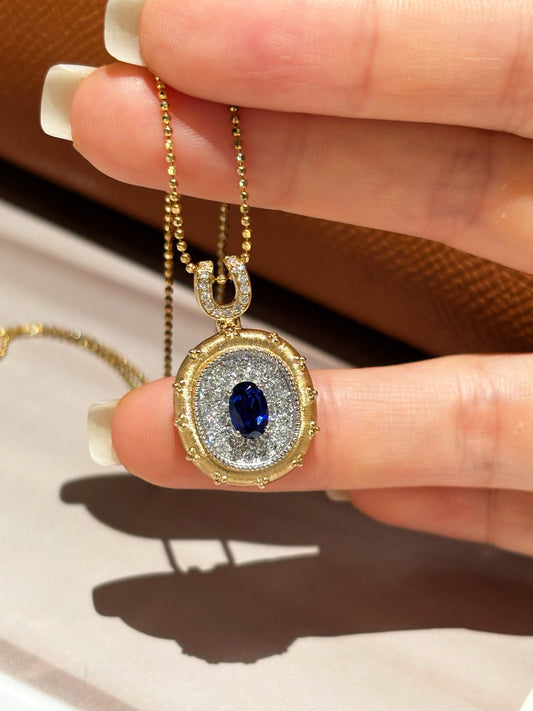 Two-Tone Solid Gold Oval Lab Grown Royal Blue Sapphire PavƩ Diamond Horseshoe Motif Locket Pendant Necklace | 18K Gold