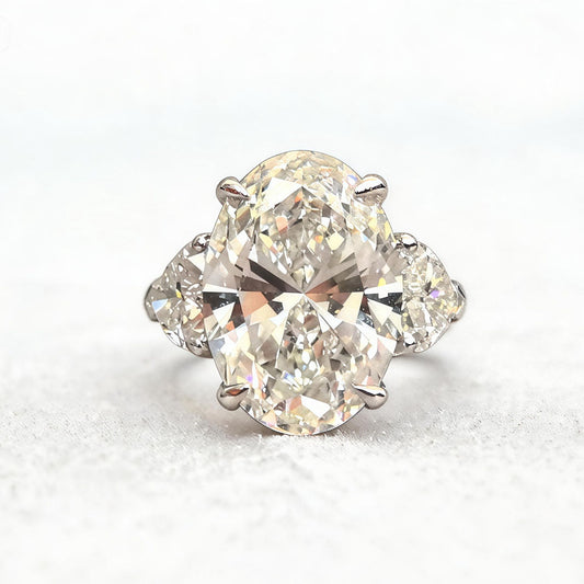 Oval-Center Trilogy Ring with Pear Sidestones