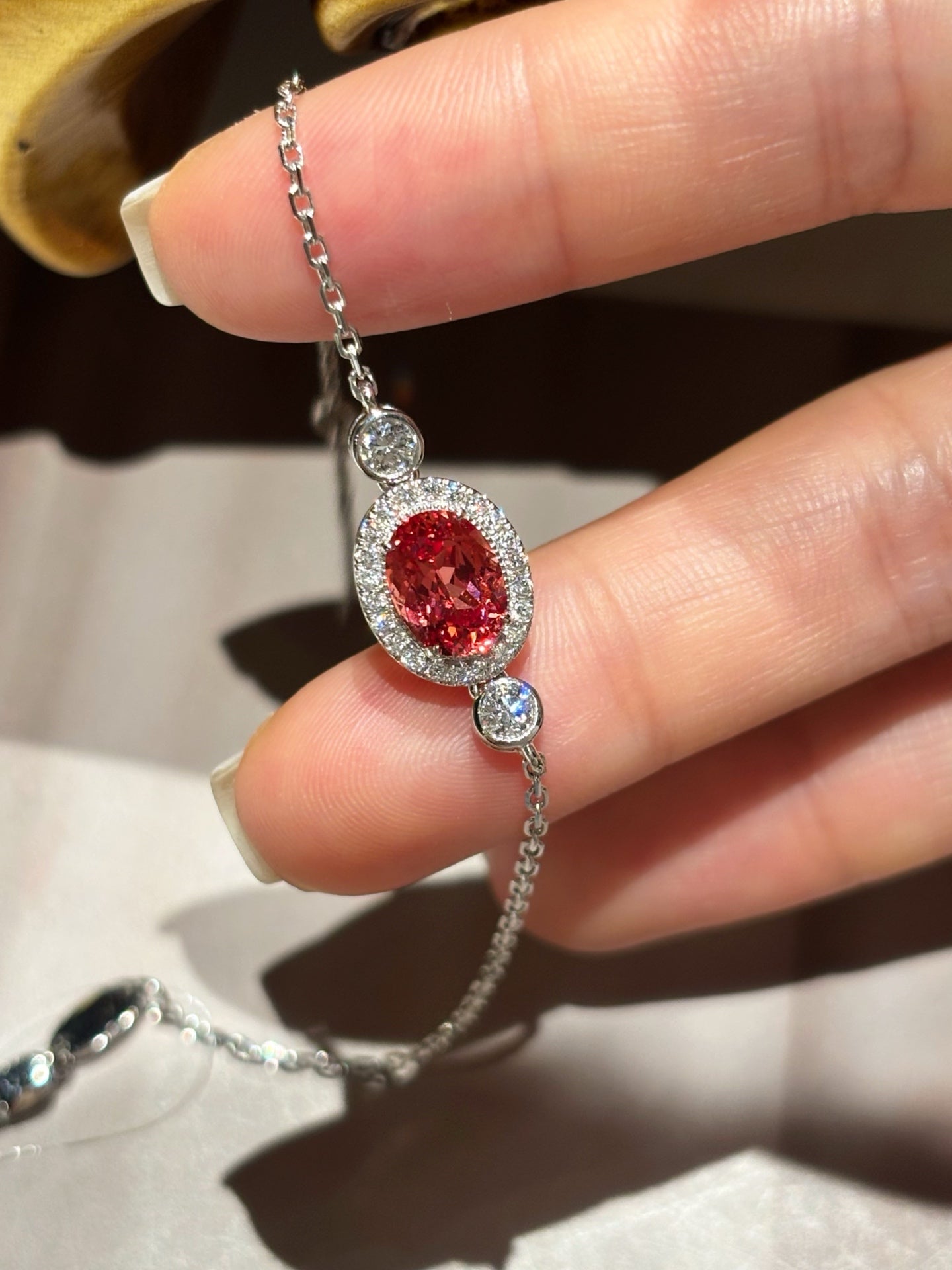 1.77ct 3.96g Oval Lab Padparadscha Sapphire Bracelet with Diamond Halo & Bezel Round Diamonds | Platinum