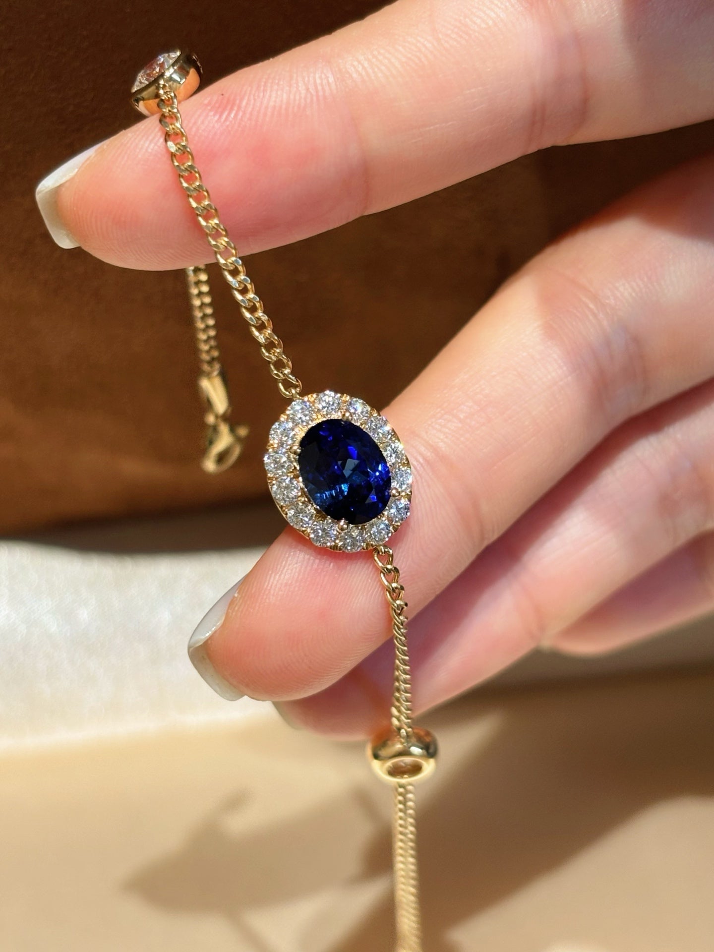Oval Lab Royal Blue Sapphire Bracelet with Diamond Halo & Bezel Round Accents | 18K Yellow Gold