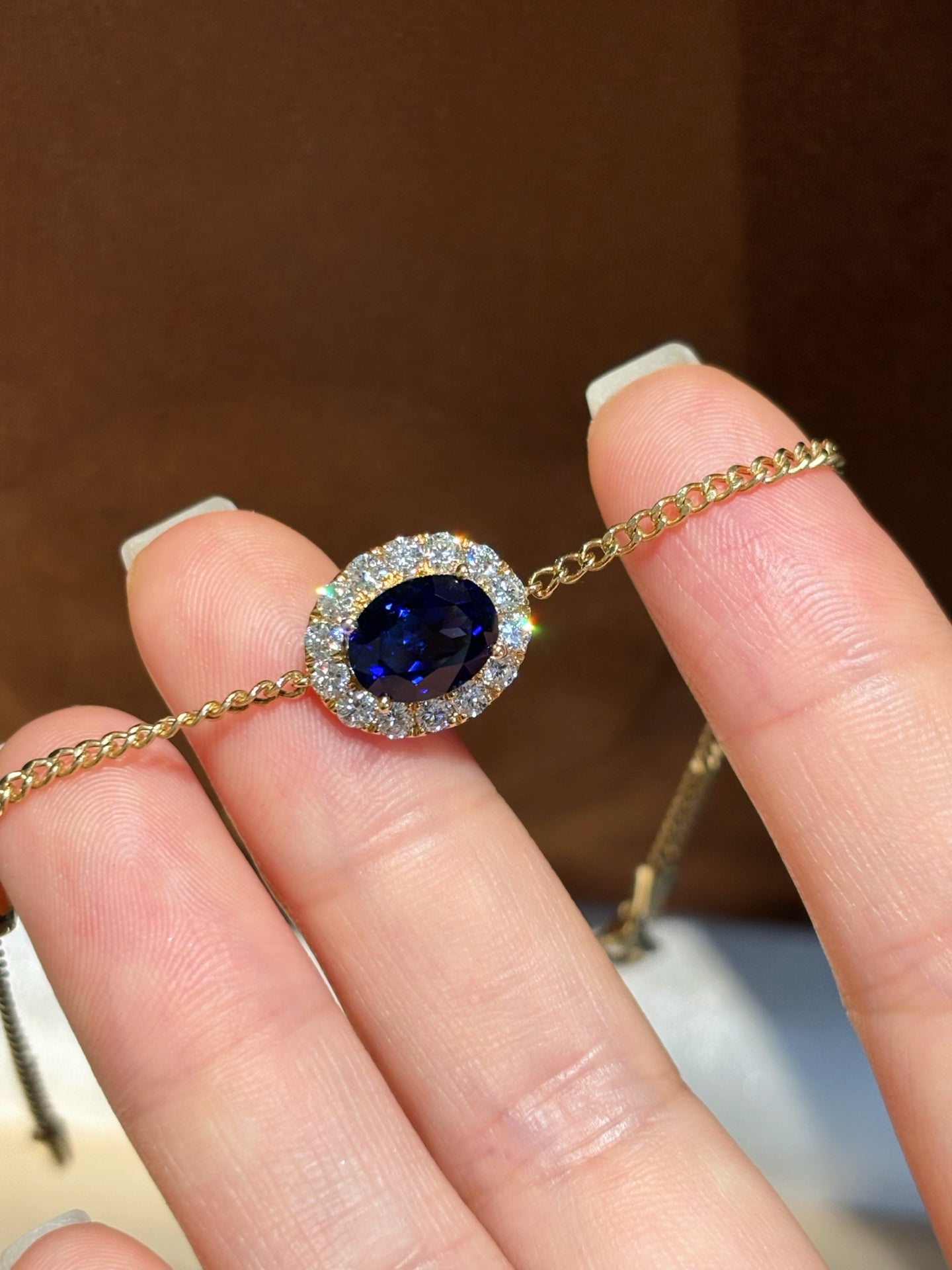 Oval Lab Royal Blue Sapphire Bracelet with Diamond Halo & Bezel Round Accents | 18K Yellow Gold