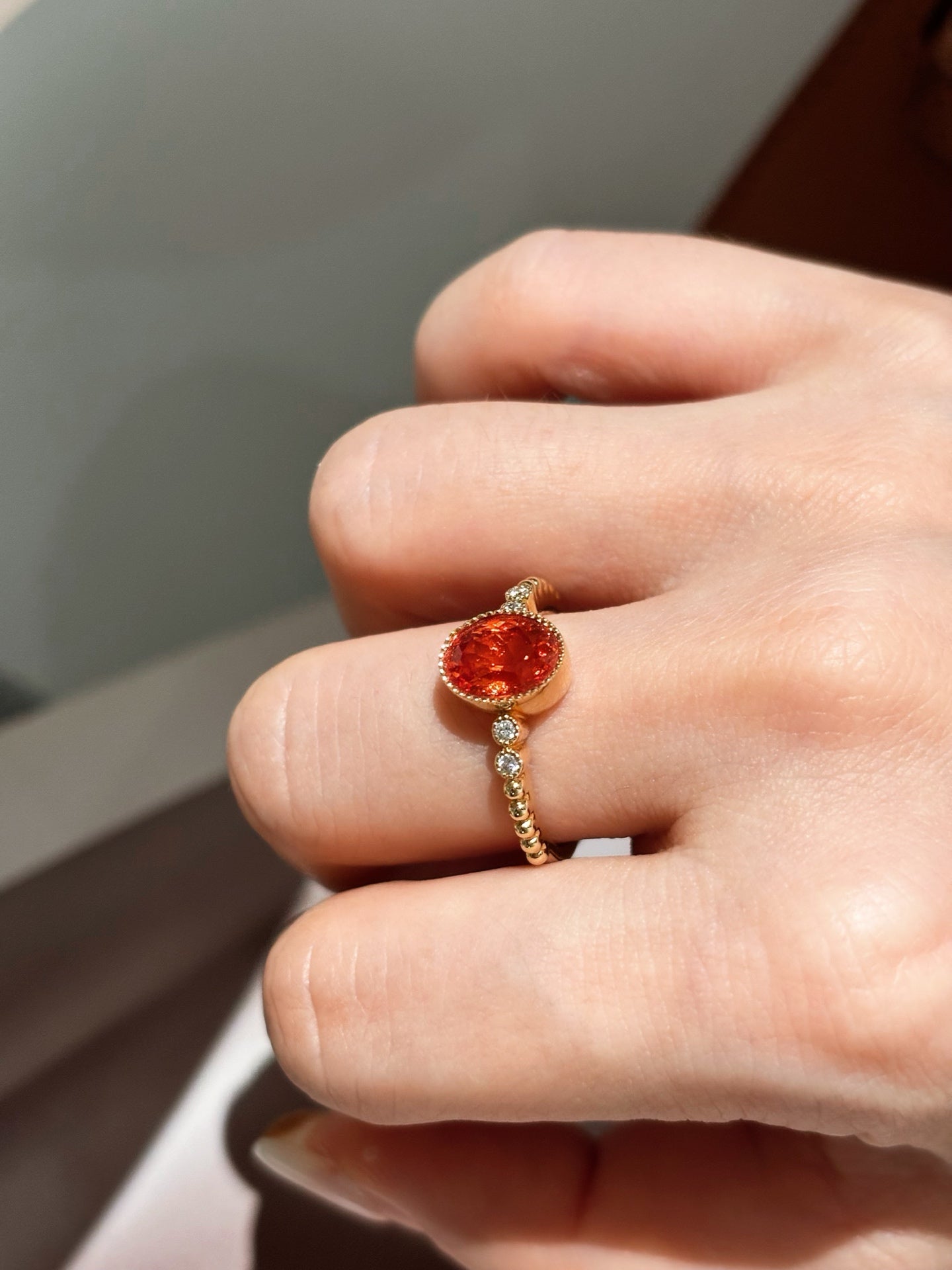 Bezel-Set Oval Orange Lab-Grown Gemstone with Diamond Accent Solitaire Ring | 18K Gold