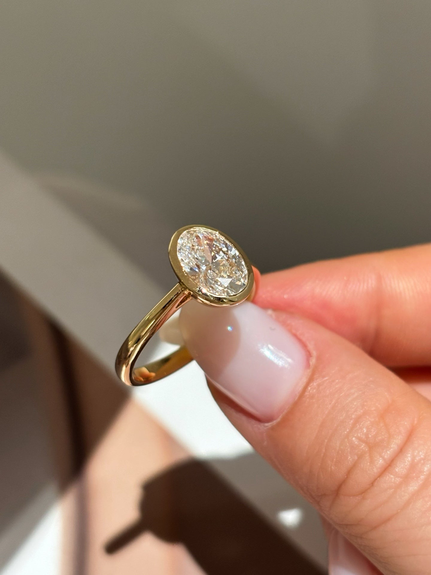 Oval Cut Lab Grown Diamond Solitaire Ring | Bezel-Set in Solid 18K Yellow Gold