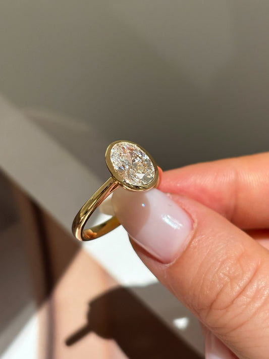 Oval Cut Lab Grown Diamond Solitaire Ring | Bezel-Set in Solid 18K Yellow Gold